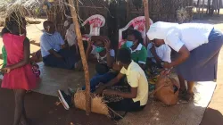 A Catholic Priest and a Religious Sister having a moment with refugees in the Catholic Diocese of Pemba in Mozambique. Thousands of refugees from Cabo Delgado have found refuge in the Diocese and the Catholic Archdiocese of Nampula/ Credit: Denis Hurley Peace Institute