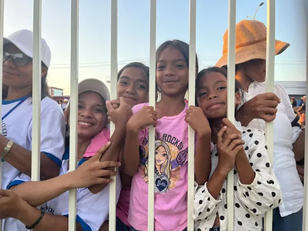 Crowds of young people line the streets of Dili, East Timor, for miles to greet Pope Francis upon his arrival to the country on Sept. 9, 2024.