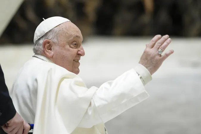 Pope Francis waves to pilgrims gathered in the Paul VI Audience Hall for his Wednesday general audience on Jan. 15, 2025, at the Vatican.