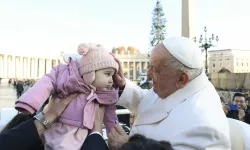 Pope Francis blesses a toddler during his general audience on Wednesday, Dec. 4, 2024, in St. Peter’s Square. / Credit: Vatican Media