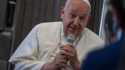 Pope Francis speaks to journalists aboard the papal plane during an in-flight press conference on Friday, Sept. 13, 2024, on his return from his nearly two-week tour of Southeast Asia. / Credit: Daniel Ibañez/CNA