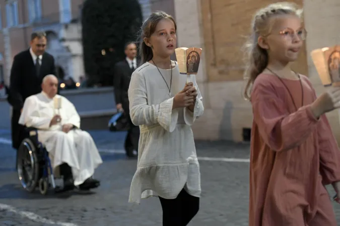 Young people lead a procession ahead of Pope Francis in Protomartyrs Square at the Vatican for an ecumenical prayer service on Oct. 11, 2024.