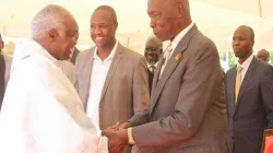 Kenya's late former President Daniel Moi (right) greeting the former Catholic Bishop of Eldoret Diocese, the late Cornelius Korir (left)