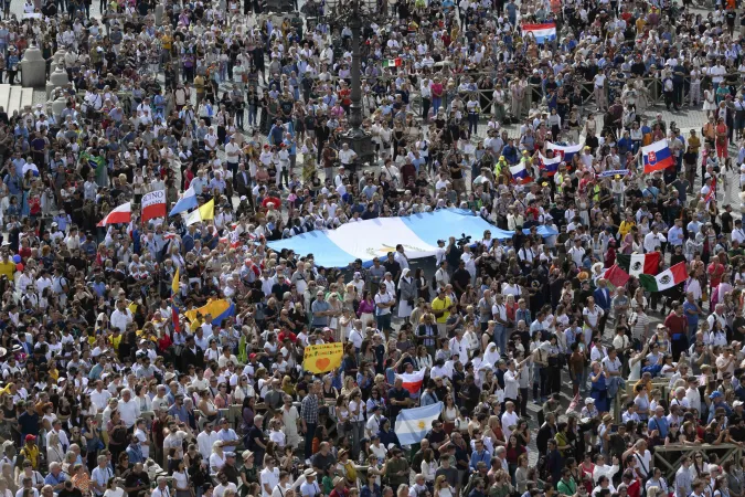 In St. Peter's Square, pilgrims waved and held flags from their countries, including a large flag from Guatemala, during Pope Francis' Sunday Angelus Sept. 22, 2024.