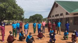 Nurses and trainee health care-givers at Mary Ward Primary Health Care Clinic in Rumbek, South Sudan pose for a photo outside the Clinic on the eve of International Nurses Day. / Sr. Orla Treacy