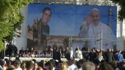 Pope Francis sits in front of an image of Blessed Giuseppe "Don Pino" Puglisi during a meeting with young people in the Archdiocese of Palermo, on the Italian island region Sicily, on Sept. 15, 2018. | Vatican Media.