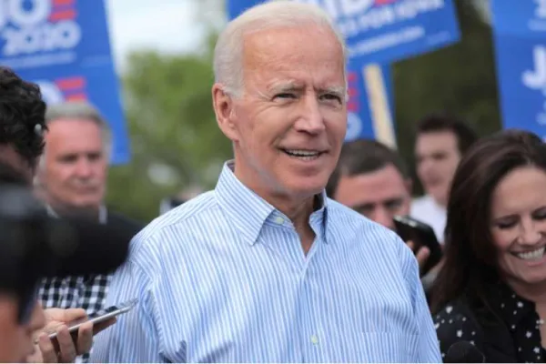 Joe Biden walking with supporters in Iowa, May 25, 2020. / Pix_Arena/Shutterstock