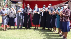 Archbishop Martin Kivuva Musonde of Kenya's Mombasa Archdiocese alongside Loreto Sisters displaying the new book, "Mary Ward - Her time is now" on 29 January 2022 at Loreto Convent Msongari. Credit: Sr. Santrina Tumusiime, IBVM