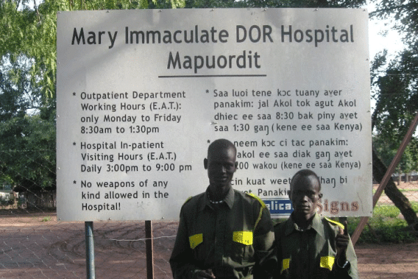 Security Officers at the entrance to the Mary Immaculate Hospital in Mapuordit, South Sudan.