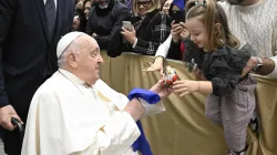 During his audience with Italian Catholic educators, Pope Francis interacts with a young girl at the Paul VI Audience Hall at the Vatican on Jan. 4, 2025. / Vatican Media