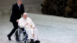 Pope Francis enters the Vatican’s Paul VI Hall in a wheelchair on May 5, 2022. | Daniel Ibáñez/CNA.