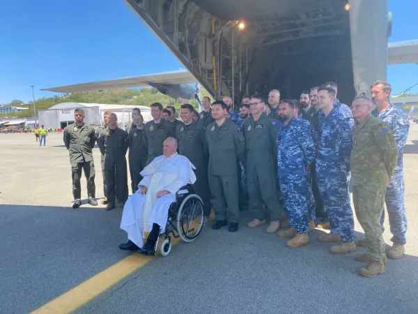 Pope Francis boarding a flight of the Royal Australian Air Force from Port Moresby to the remote town of Vanimo, Papua New Guinea.