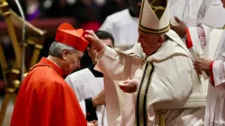 Pope Francis places the red biretta on Cardinal Domenico Battaglia, archbishop of Naples, during the consistory for the creation of 21 new cardinals in St. Peter's Basilica, Dec. 7, 2024. / Credit: Daniel Ibáñez/CNA