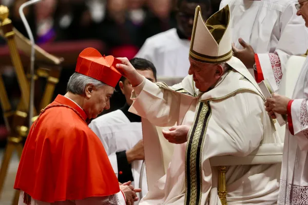 Pope Francis places the red biretta on Cardinal Domenico Battaglia, archbishop of Naples, during the consistory for the creation of 21 new cardinals in St. Peter's Basilica, Dec. 7, 2024. / Credit: Daniel Ibáñez/CNA