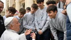 Pope Francis speaks with young men during a general audience. / Credit: Vatican Media