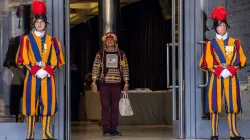 A participant in the Vatican's Amazon synod is flanked by two members of the Swiss Guard. Credit: Daniel Ibanez/CNA