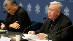 Cardinal Jean-Claude Hollerich (right), relator general of Synod on Synodality, speaks to the media on June 20, 2023, at the temporary headquarters of the Holy See Press Office in Vatican City. Beside him is Cardinal Mario Grech, the secretary general for the Synod of Bishops. / Credit: Daniel Ibáñez/CNA