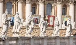 Statuary sits before imagery of the recently canonized saints in St. Peter's Square at the Vatican, Sunday, Oct. 20, 2024 / Credit: Daniel Ibáñez/CNA