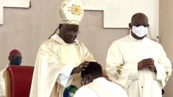 Archbishop Ignatius Ayau Kaigama laying hands on one of the Deacons ordained Priest on August 15 in Nigeria's Abuja Archdiocese. / Abuja Archdiocese