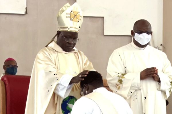 Archbishop Ignatius Ayau Kaigama laying hands on one of the Deacons ordained Priest on August 15 in Nigeria's Abuja Archdiocese. / Abuja Archdiocese