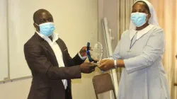 ZCBC Finance Manager, Sr. Angela Mugwenhi celebrates with Mr. Albert Dhafana while Dorcas Mugugu looks on. Credit: Catholic Church News Zimbabwe