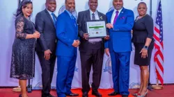 Br. Andrea Sifuna poses with Ichange Nations officials on February 26 after being awarded for empowering marginalized youth through his Coaching programme. Credi: Br. Andrea Sifuna.