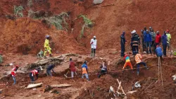 Rescue workers search for casualties at the site of the landslide caused by heavy rains in Gouache, Bafoussam West Region, Cameroon: October 30, 2019