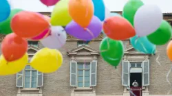 Children participating in a Catholic Action initiative helped to release colorful balloons at the end of the Angelus on Jan. 30, 2022. Vatican Media