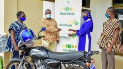 Sr. Monica Yahaya receives a cheque from BasicNeeds-Ghana Executive Director,  Pater Badimak Yaro. / Courtesy