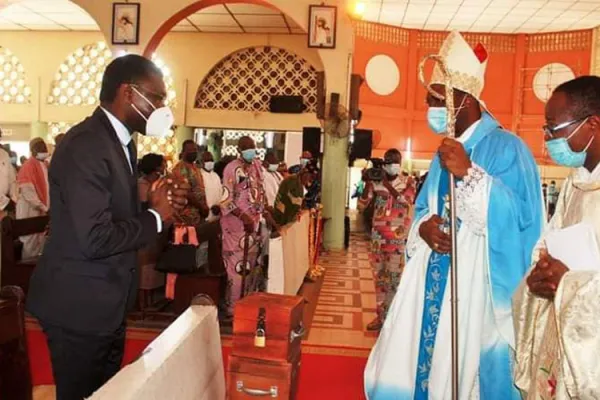 Archbishop Roger Houngbédji greets Benin's president of the constitutional council Joseph Djogbenou during the prayer service at Our Lady of Mercy Cathedral in Cotonou Archdiocese. / Courtesy Photo