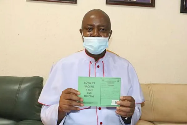 Bishop Callistus Valentine Onaga of the Catholic Diocese of Enugu in Nigeria holds his vaccination card after receiving the COVID-19 vaccine. / Diocese of Enugu