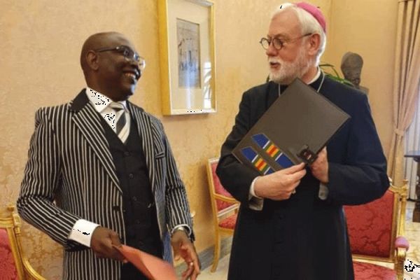 Archbishop Paul Richard Gallagher (right), Vatican's Secretary for Relations with States and Mr. Robert Compaore (left), Ambassador of Burkina Faso to the Holy See during the exchange of the Instruments of Ratification of the Agreement between the Holy See and the State of Burkina Faso on the legal status of the Catholic Church in Burkina Faso. / Holy See Press Office