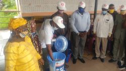 Members of Caritas Guinea distributing health kits to some vulnerable families in Conakry.