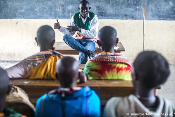 A Catechist in Uganda takes refugees from neighbouring South Sudan through a class/ Credit: Aid to the Church in Need