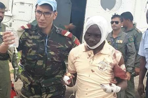 Injured Fr Guy-Robert Mandro being taken to hospital by officials of the United Nations Organization Stabilization Mission in the DRC (MONUSCO).