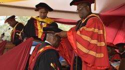 The University Chancellor, Rt. Rev. Charles Kasonde confers a doctorate degree to a graduand during the 38th Graduation at the Catholic of Eastern Africa, Langata, Oct 25, 2019 . / Catholic University of Eastern Africa (CUEA)