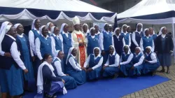 Bishop Joseph Mwongela of Kenya's Kitui Diocese poses for a photo with Pauline Sisters on Friday, 5 April 2024 after perpetual profession of their three members. Credit: ACI Africa.