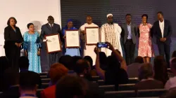 The award was presented to Fr. Justin Ndéma who represented Cardinal Dieudonné Nzapalaïnga, Apostle Nicolas Guérékoyamé Gbangou, and the widow of Imam Omar Kobine Layama. Credit: Aegis Trust