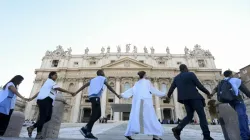 Young people from around the world held hands in St. Peter's Square during the #NotAlone human fraternity event June 10, 2023. | Vatican Media