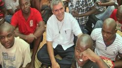 Fr. Antonio Perretta, director of Casa da Misericórdia, Archdiocese of Maputo in Mozambique, with inmates in one of the prisons in Maputo.