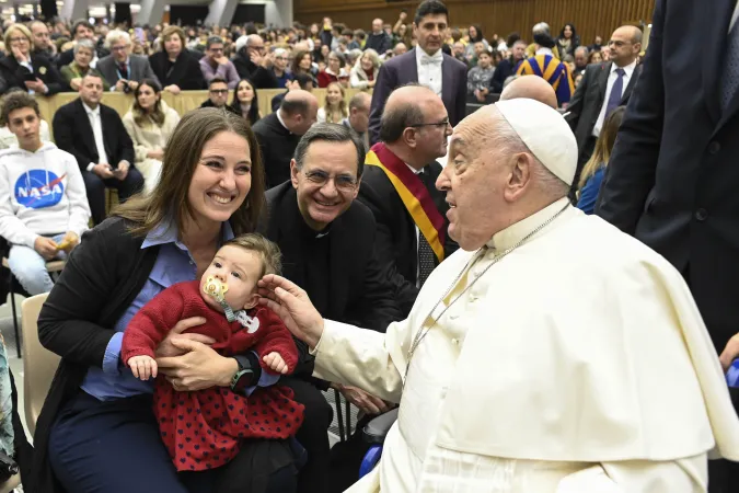 Pope Francis blesses a baby during the Saturday Jubilee audience in the Vatican’s audience hall, Jan. 11, 2025.