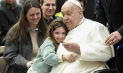 Pope Francis is hugged by a young visitor at his general audience at the Vatican, Wednesday, Feb. 12, 2025. / Credit: Vatican Media