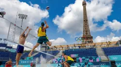 Norwegian players Christian Sorum (L), Anders Mol (2ndL) and Australian players Zachery Schubert (2ndR) and Thomas Hodges (R) take part in a practice session ahead of the opening of the Paris 2024 Olympic Games at the Eiffel Tower Stadium in Paris on July 24, 2024. / Credit: ODD ANDERSEN/AFP via Getty Images