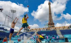 Norwegian players Christian Sorum (L), Anders Mol (2ndL) and Australian players Zachery Schubert (2ndR) and Thomas Hodges (R) take part in a practice session ahead of the opening of the Paris 2024 Olympic Games at the Eiffel Tower Stadium in Paris on July 24, 2024. / Credit: ODD ANDERSEN/AFP via Getty Images