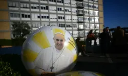 A balloon with an image of Pope Francis is pictured outside the Gemelli University Hospital where Pope Francis is hospitalized with pneumonia, in Rome on March 3, 2025. Pope Francis suffered two new breathing attacks on March 3, 2025, the Vatican said, as the 88-year-old pontiff struggles to recover from pneumonia. / Credit: Photo by FILIPPO MONTEFORTE/AFP via Getty Images