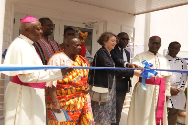 Bishop Emmanuel Fianu, Episcopal Chairman of Health in Ghana (2nd from right) being supported by Tove Dengbol, Danish Ambassador to Ghana, Ibrahim Bakayoko, the Regional Manager, West and Central Africa of Novo Nordisk and Bishop Joseph Afrifah-Agyekum of Koforidua Diocese to cut the tape to commission the St. Pauline Clinic at the National Catholic Secretariat, Accra on February 7, 2020. / Damian Avevor.