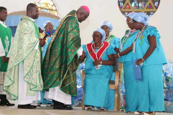 Archbishop John Bonaventure Kwofie, Apostolic Administrator of the Sekondi-Takoradi Diocese congratulating Dame Theresa Arkhurst after her installation as the 8th National President of the St. Theresa of the Child Jesus Society at the Star of the Sea Cathedral at Takoradi on November 17, 2019. / Damian Avevor