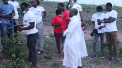 Some members of the Ignitian Youth Network (IYNIGO), a youth
Empowerment wing of the Arrupe Jesuit Institute in Ghana with the Founding Director of the Arrupe Jesuit Institute, Fr. Kpanie Addy, SJ preparing for the tree planting exercise. / Denis Eyram Quashie