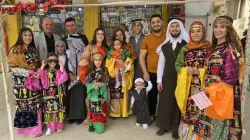 A Christian family in Qaraqosh sporting their traditional dressing for Holy Week in April 2022. Bashar Yameel Hanna/CNA