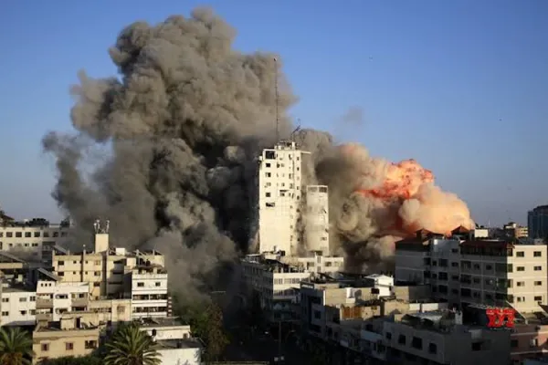 Image of buildings burning in the ongoing Israeli-Palestinian violence. Credit: Courtesy Photo